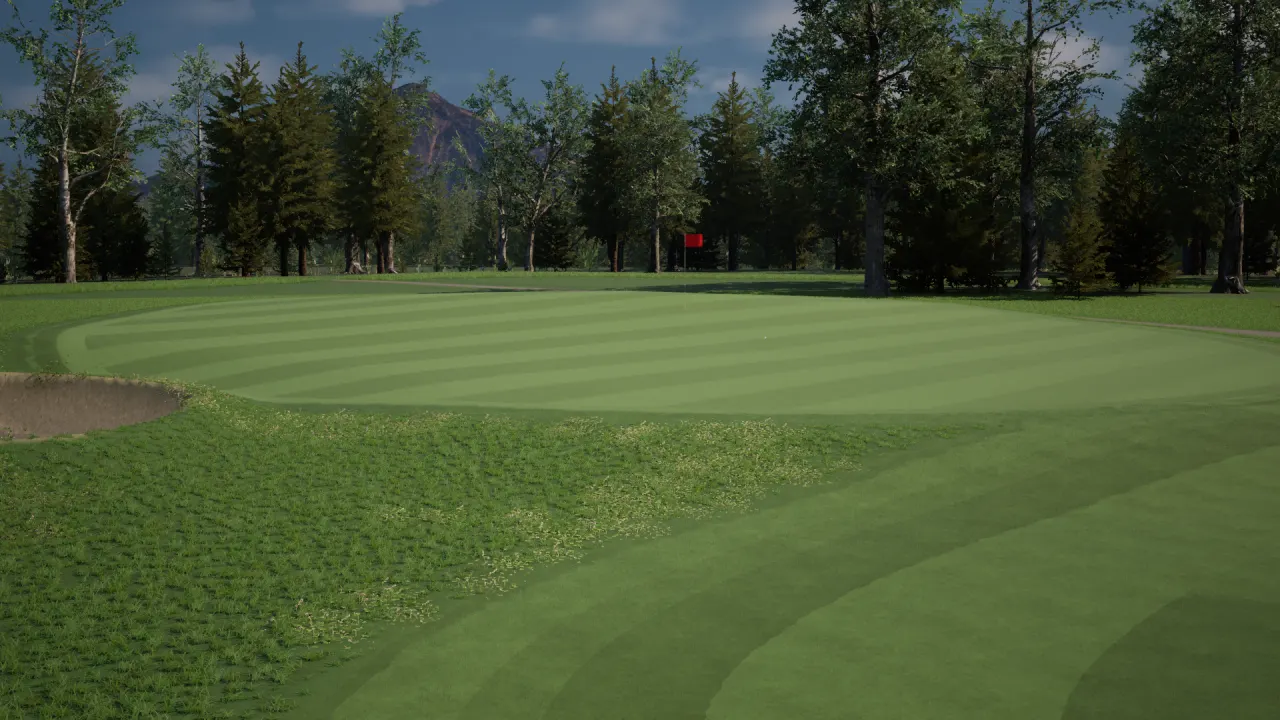 Golf simulator: a striped green with a red flag, bunker and tree line under a mountain